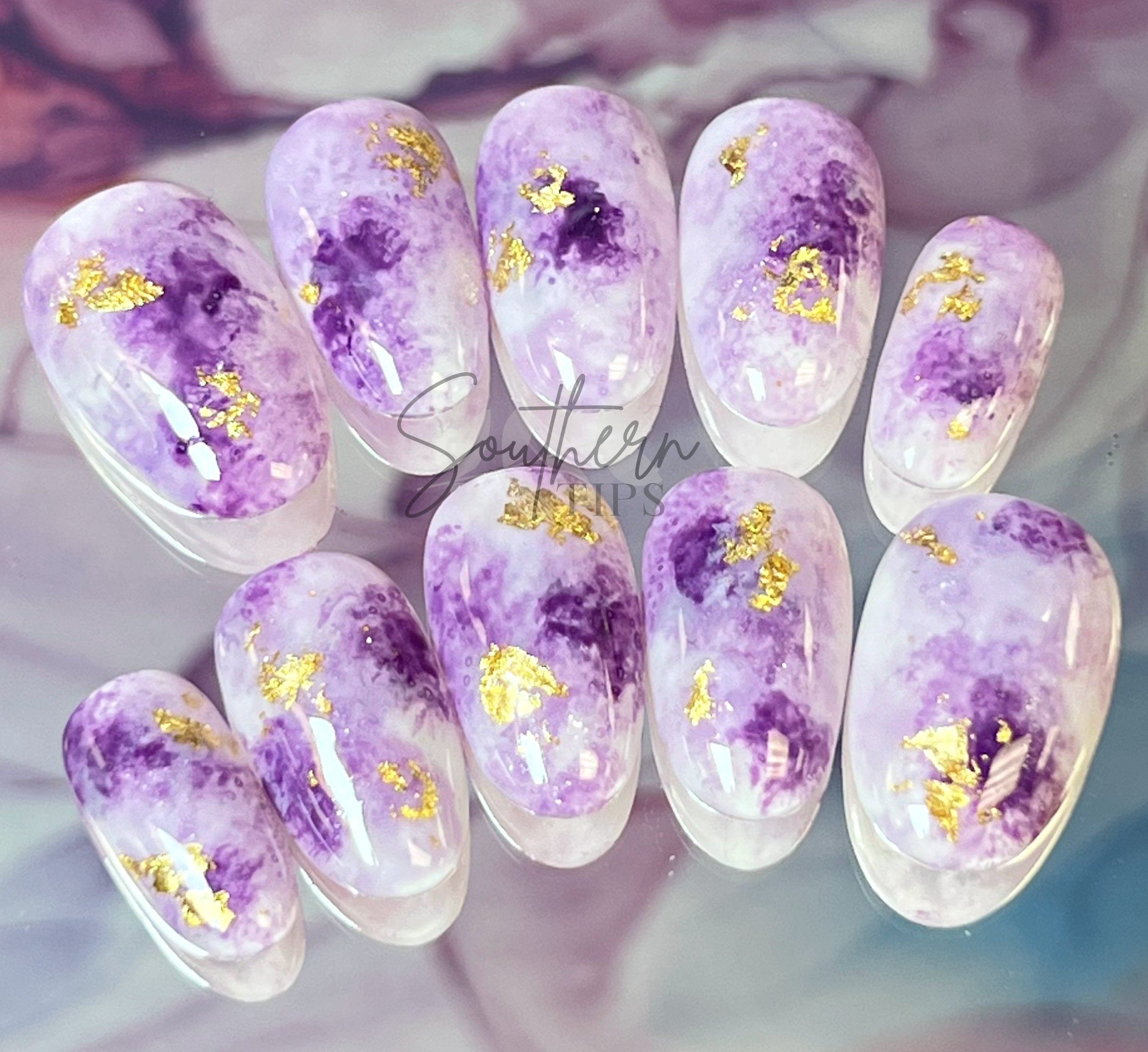 Dress your nails to impress with this marbled amethyst nail art with gold  flakes! - Lucy's Stash